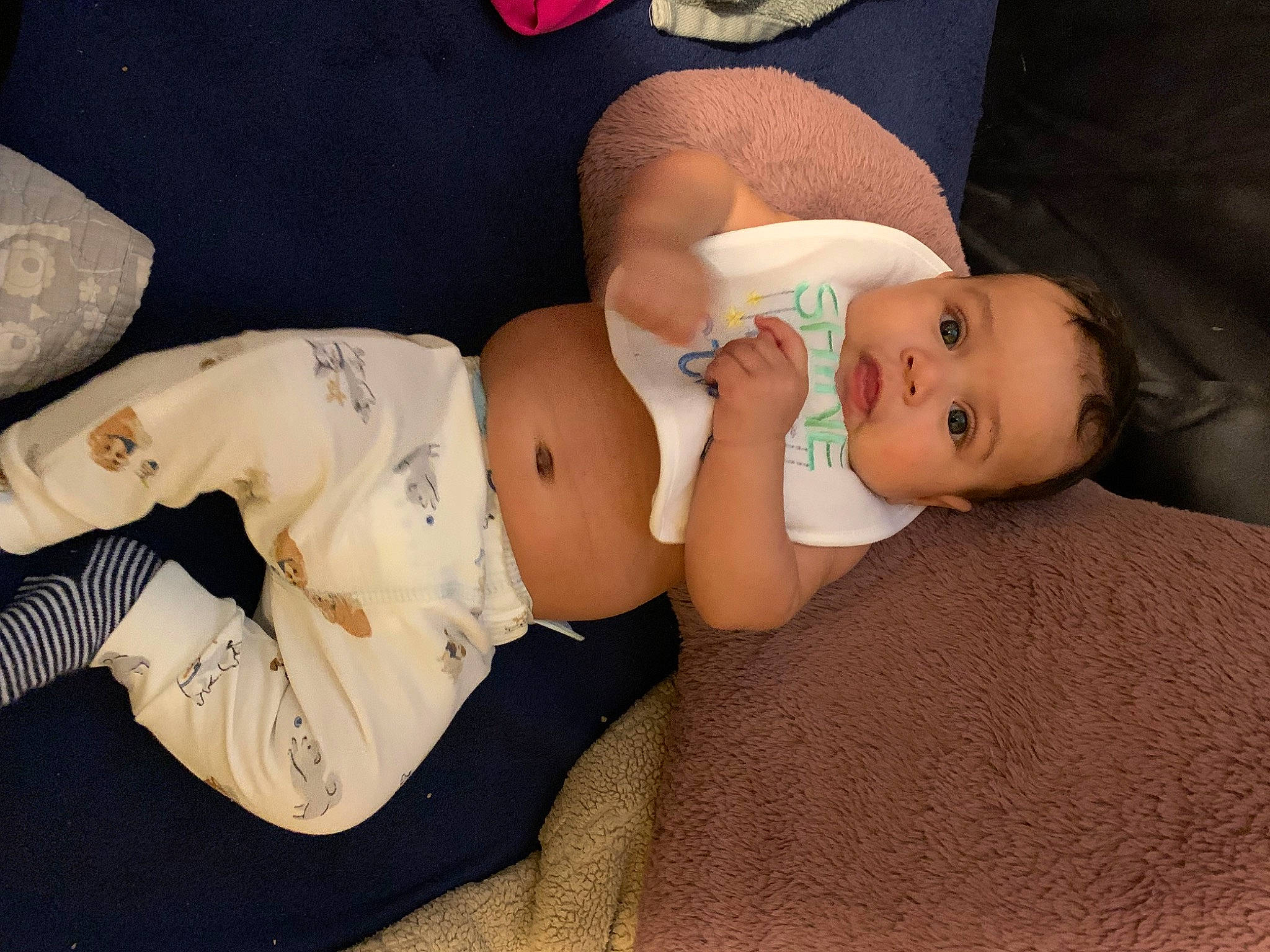 Charles is registered to the contest to win money with this photo: abdomen, baby, baby_sleeping, baby_toddler_clothing, comfort, eye, flash_photography, glasses, hat, head, headgear, human_body, human_leg, knee, person, skin, stomach, thigh, toddler, trunk