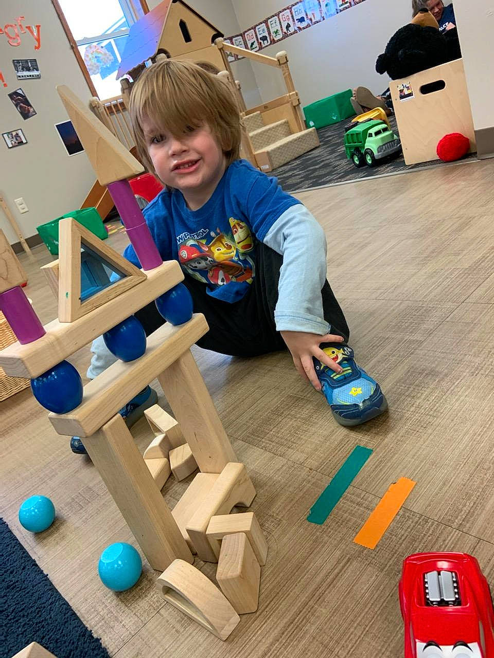Prestyn is registered to the contest to win money with this photo: blue, chair, child, educational_toy, engineering, flooring, fun, hardwood, interlocking_block, learning, leisure, person, plastic, play, recreation, room, toddler, toy, toy_block, varnish