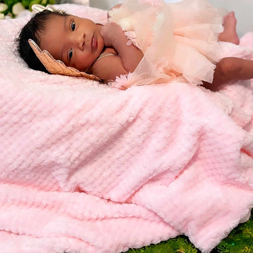 Layvonni joined the competition — help win amazing prizes! baby, bed, blanket, bodypart, clothing, face, finger, furniture, hand, happy, head, indoors, newborn, person, photography, portrait, quilt, sleeping, smile, towel