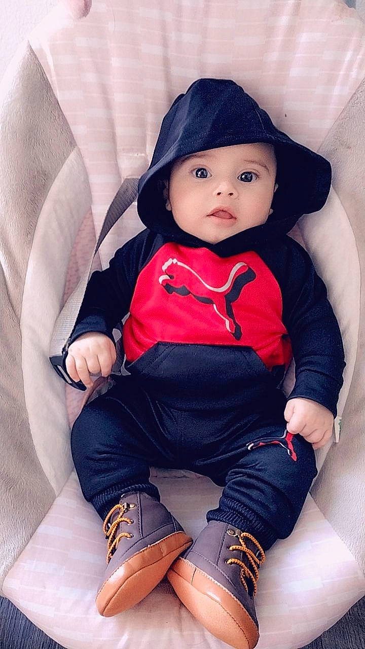 Armando joined the competition — help win amazing prizes! baby, baby_products, baby_toddler_clothing, cap, child, comfort, cool, electric_blue, fashion_accessory, headwear, human_leg, knee, leg, person, sitting, sleeve, sock, t_shirt, textile, thigh