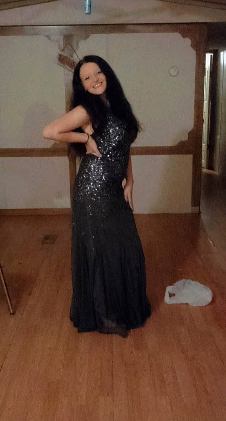 Gabby joined the competition — help win amazing prizes! abdomen, black_hair, dress, fashion_design, flash_photography, floor, flooring, formal_wear, gown, happy, joy, long_hair, neck, one_piece_garment, person, shoulder, sleeve, smile, thigh, trunk