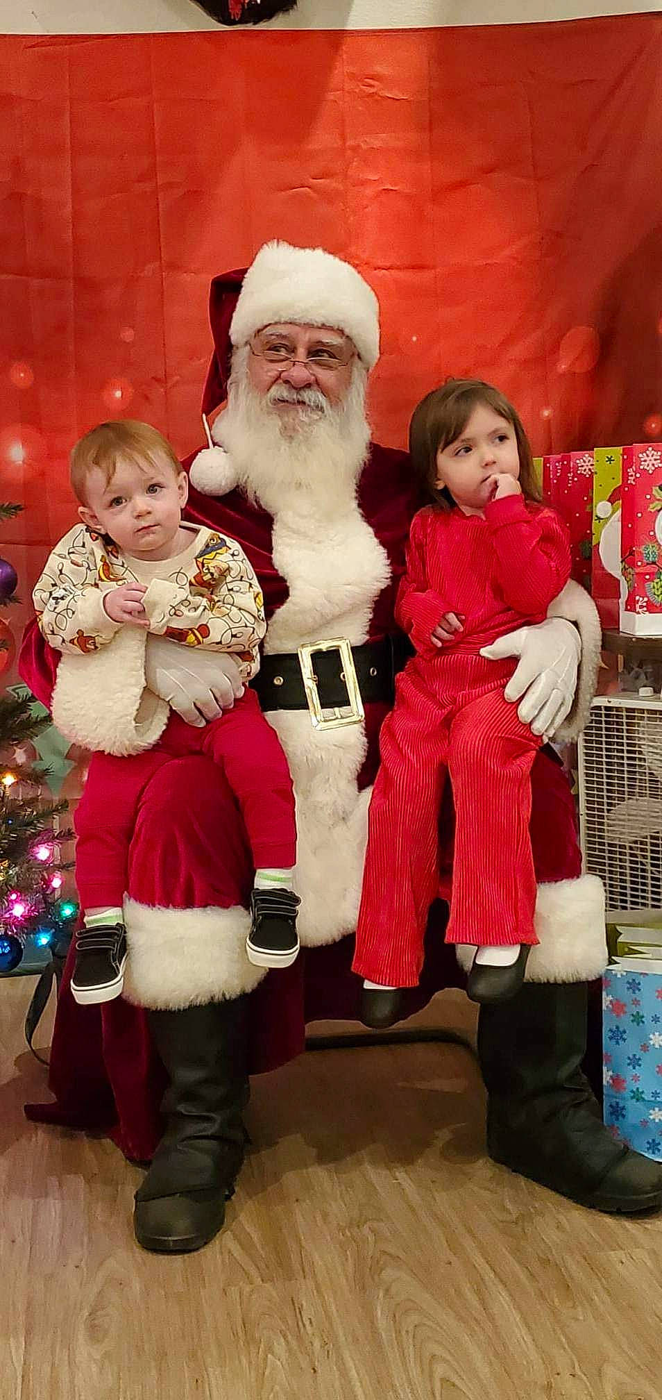 Makinzly joined the competition — help win amazing prizes! beard, boot, child, christmas, christmas_decoration, christmas_eve, event, fictional_character, fun, fur, happy, hat, head, headwear, holiday, lap, person, red, santa_claus, smile