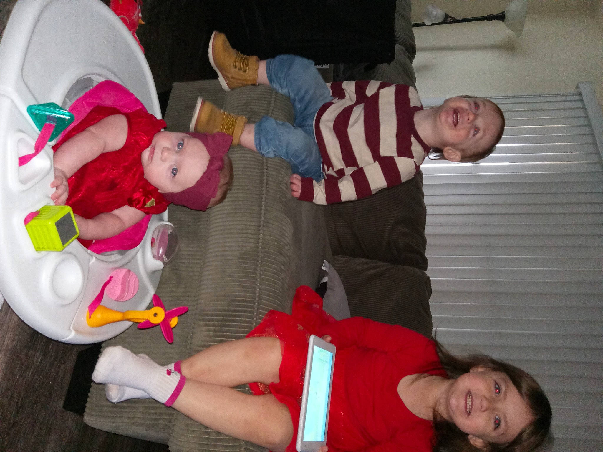 Nakaiya is registered to the contest to win money with this photo: baby, baby_products, baby_toddler_clothing, carmine, child, comfort, event, fun, headwear, human_leg, joy, knee, lap, organ, person, red, room, smile, sock, stuffed_toy