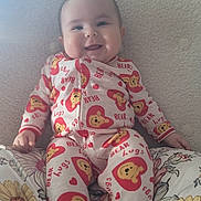 Lily joined the competition — help win amazing prizes! baby, bed, blanket, bodypart, clothing, couch, cushion, face, finger, furniture, hand, happy, head, homedecor, pajamas, person, photography, portrait, quilt, smile