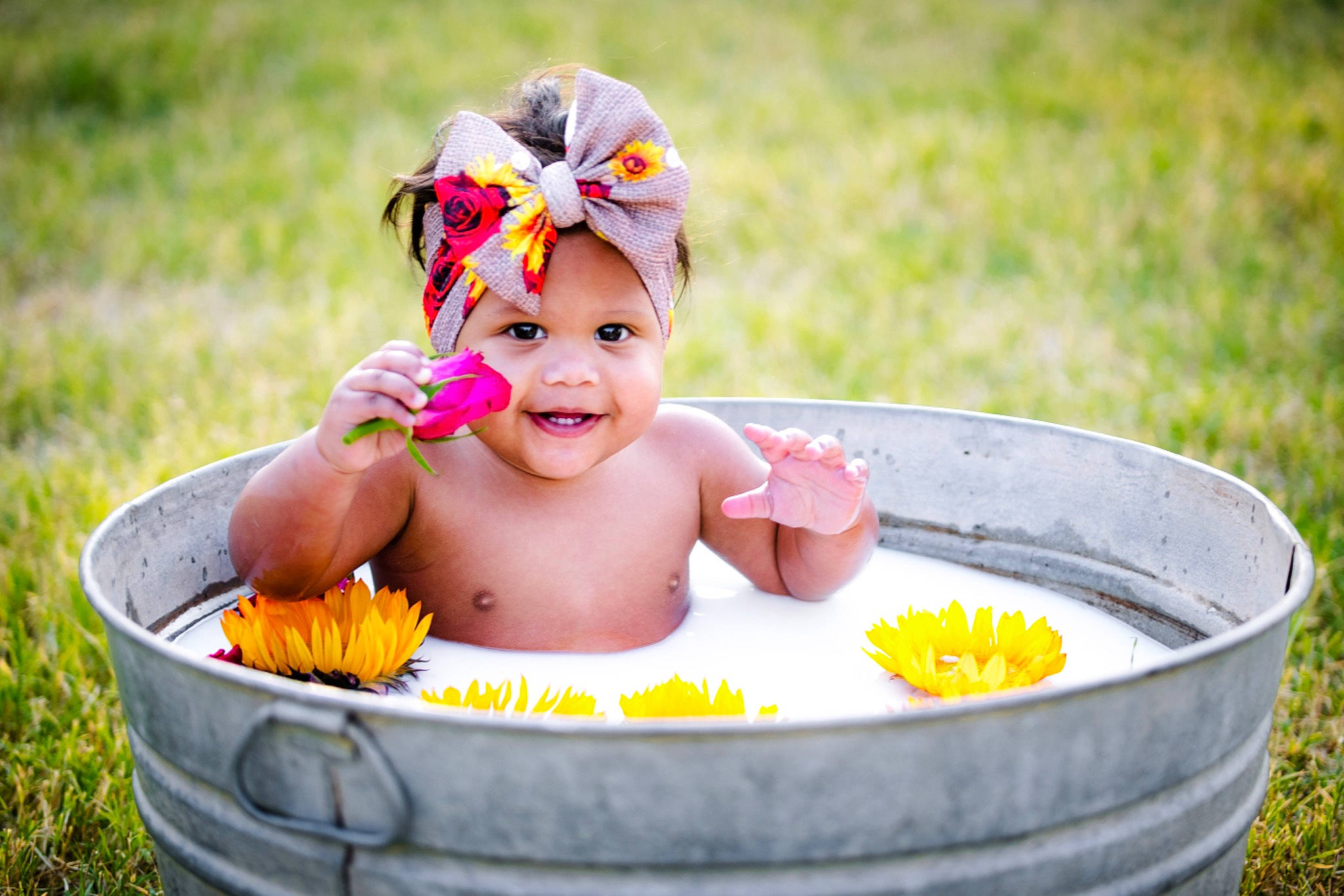 Maddelyn is registered to the contest to win money with this photo: baby, baby_bathing, baby_laughing, baby_toddler_clothing, bathing, cheek, child, child_model, facial_expression, fun, grass_family, hair_accessory, happy, headband, headpiece, headwear, people_in_nature, person, playing_with_kids, summer
