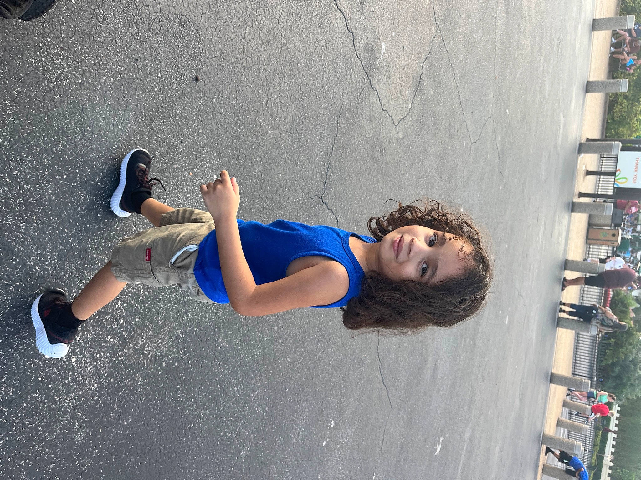 Israel is registered to the contest to win money with this photo: asphalt, concrete, denim, elbow, electric_blue, fun, human_leg, joy, knee, leisure, pedestrian, person, recreation, road, road_surface, shadow, sidewalk, street, thigh, tree