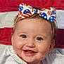 accessories, americanflag, baby, bodypart, bowtie, clothing, dress, face, flag, formalwear, happy, head, headband, mouth, person, photography, portrait, smile, teeth, tie