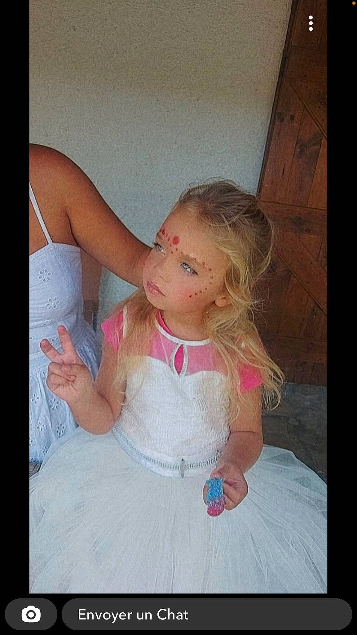 Adelysse participe au concours pour gagner de l'argent avec cette photo : baby, baby_toddler_clothing, bridal_accessory, bridal_clothing, child, day_dress, dress, facial_expression, fashion, finger, flash_photography, fun, gesture, hand, happy, iris, person, pink, skin, textile