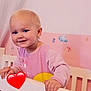 Hortense a rejoint le concours — aidez-le/la à gagner de superbes lots ! toddler, child, crib, smiling, blonde_hair, pink_wall, butterfly_stickers, cloud_sticker, heart_emoji, nursery, baby_clothes, hand, white_crib, cute, indoors, portrait, happy, young_child, room_decor, infant