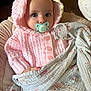 Nora joined the competition — help win amazing prizes! baby, infant, pacifier, blanket, pink_hoodie, knitted_clothing, cute, portrait, child, soft_texture, indoor, seated, hand, wide_eyes, warm_clothing, fabric, comfort, young_child, face, closeup
