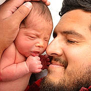 Arthur is registered to the contest to win money with this photo: newborn, baby, infant, father, parent, family, portrait, close_up, kiss, affection, sleepy, face, beard, man, hands, holding, cuddling, indoors, love, bonding