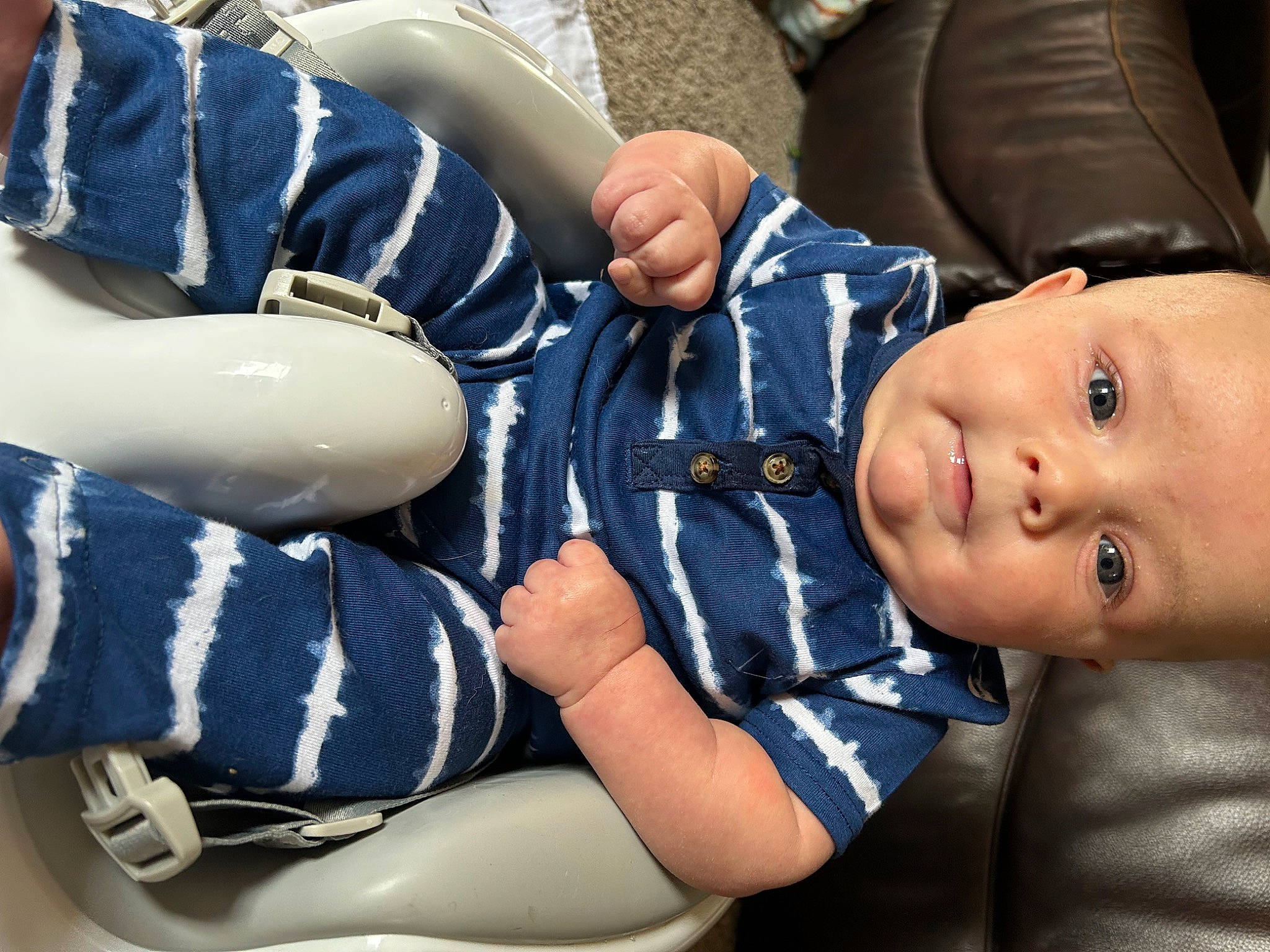 Colter joined the competition — help win amazing prizes! baby, baby_products, baby_toddler_clothing, child, comfort, elbow, electric_blue, fashion_accessory, gesture, glove, grass, hand, human_leg, knee, mammal, person, sitting, sleeve, thigh, toddler