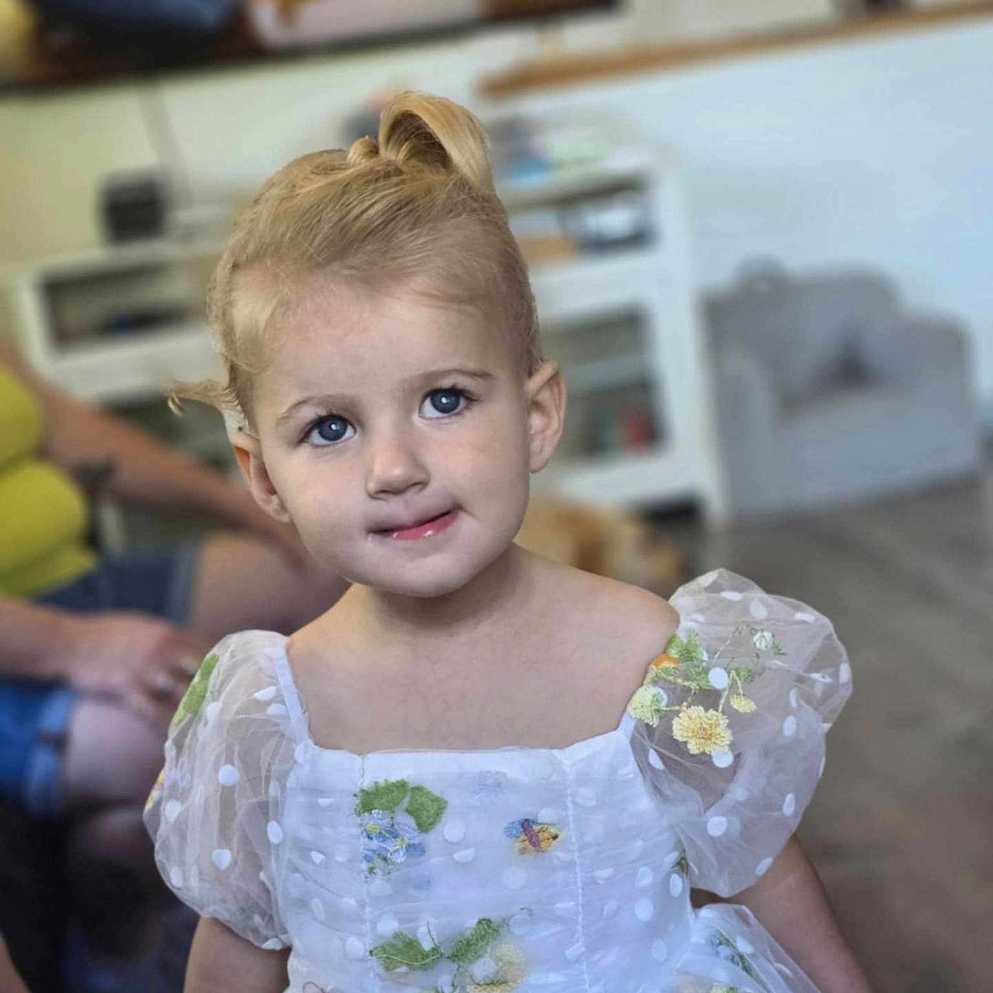 Lillian joined the competition — help win amazing prizes! toddler, child, dress, white_dress, floral_embroidery, polka_dots, blue_eyes, indoor, home_interior, furniture, adult, blond_hair, curly_hair, puffy_sleeves, portrait, cute, smile, person, young_child, soft_lighting