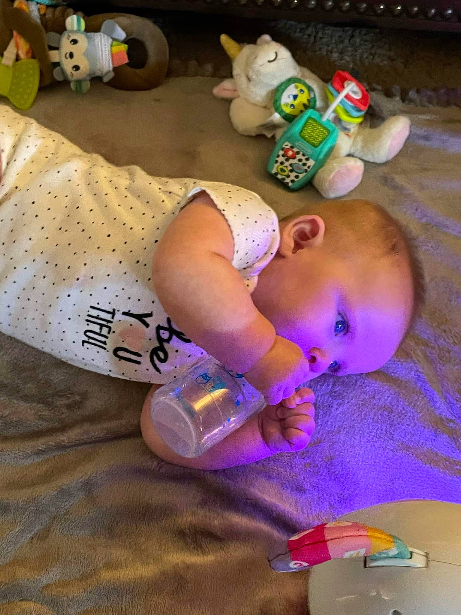 Adriana is registered to the contest to win money with this photo: baby, baby_products, baby_toddler_clothing, baby_toys, cheek, child, face, flooring, fun, grass, mouth, nail, person, pink, play, purple, room, skin, toddler, toy