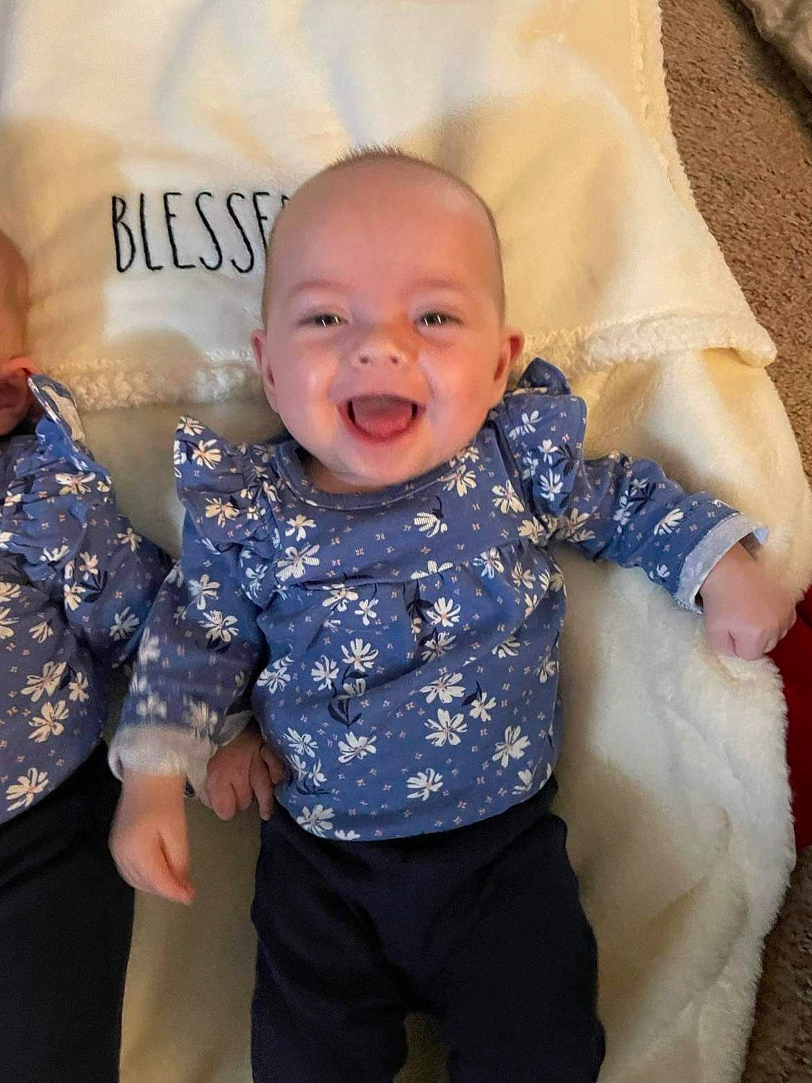 Kinsley is registered to the contest to win money with this photo: baby, baby_toddler_clothing, comfort, eye, facial_expression, finger, gesture, hairstyle, happy, head, human_body, iris, mammal, person, pink, skin, sleeve, smile, textile, toddler