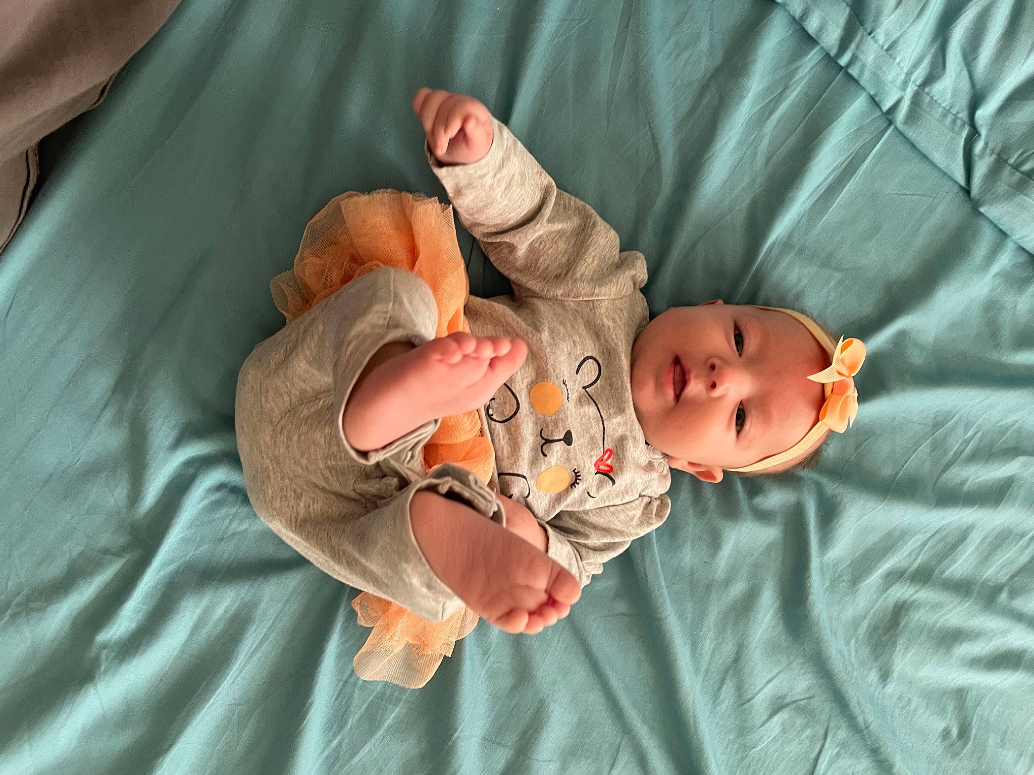 Mariana is registered to the contest to win money with this photo: baby, baby_products, baby_toddler_clothing, child, comfort, eye, finger, gesture, head, health_care, human_body, linens, mouth, peach, person, room, skin, sleeve, textile, thumb