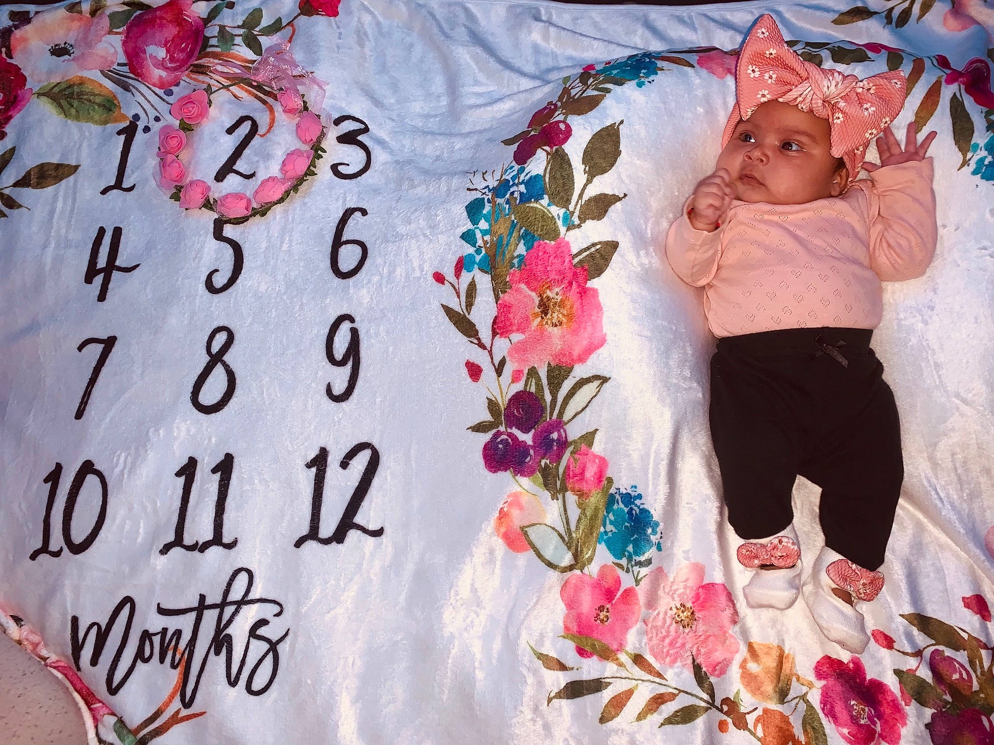 Jaylanie is registered to the contest to win money with this photo: baby_toddler_clothing, dress, facial_expression, fashion, hand, happy, headwear, human, leaf, linens, magenta, outerwear, pattern, people, person, pink, plant, product, skin, sleeve
