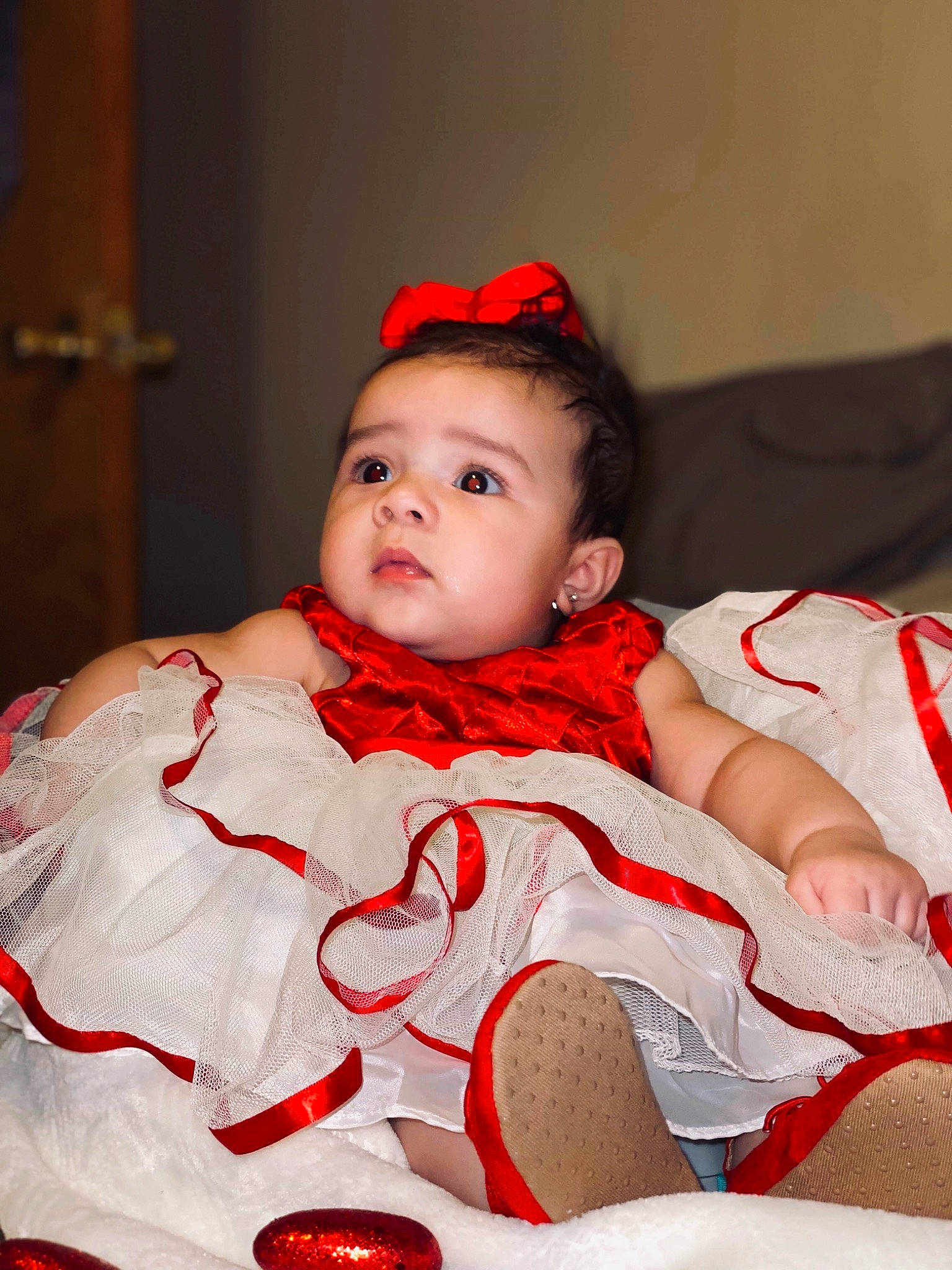 Elia is registered to the contest to win money with this photo: baby, beauty, cheek, child, child_model, dress, face, hair_accessory, happy, head, lip, person, photo_shoot, photography, portrait_photography, red, skin, smile, toddler, tradition