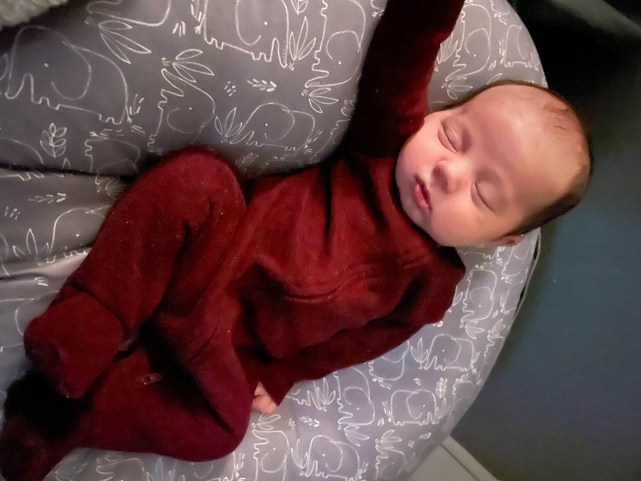 Micah is registered to the contest to win money with this photo: carmine, child, comfort, elbow, eye, eyebrow, finger, flash_photography, flesh, hair, human_body, human_leg, linens, lip, magenta, mouth, nap, neck, person, sitting