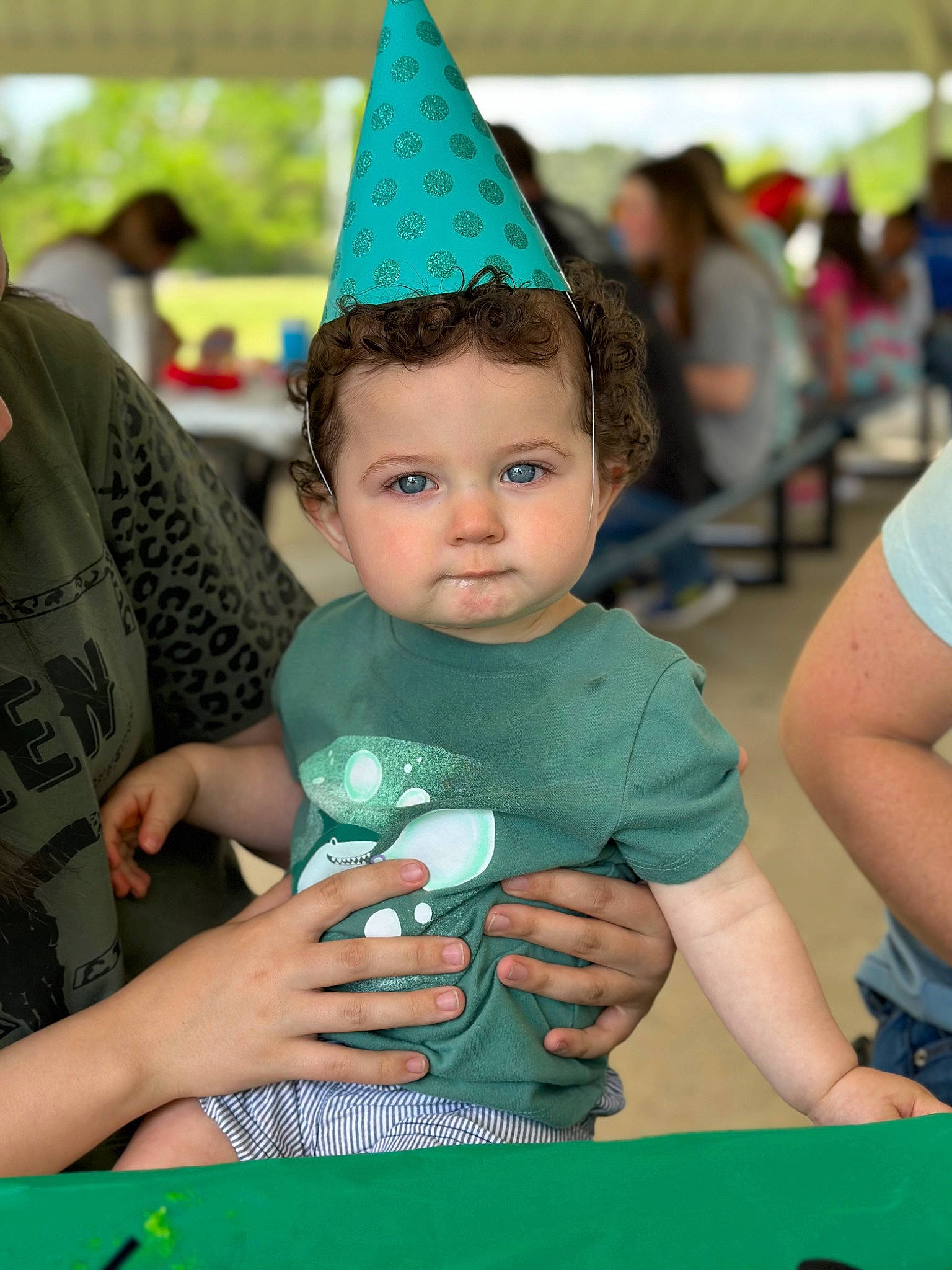 Micah is registered to the contest to win money with this photo: birthday, cap, child, cone, costume_hat, event, fashion_accessory, fun, green, happy, leisure, party, party_hat, party_supply, person, recreation, snapshot, t_shirt, table, toddler