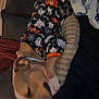 dog, sleeping, pajamas, halloween, ghosts, boo, couch, blanket, resting, pet, cozy, indoor, cute, animal, comfort, relaxation, brown_dog, face_partial, person, home