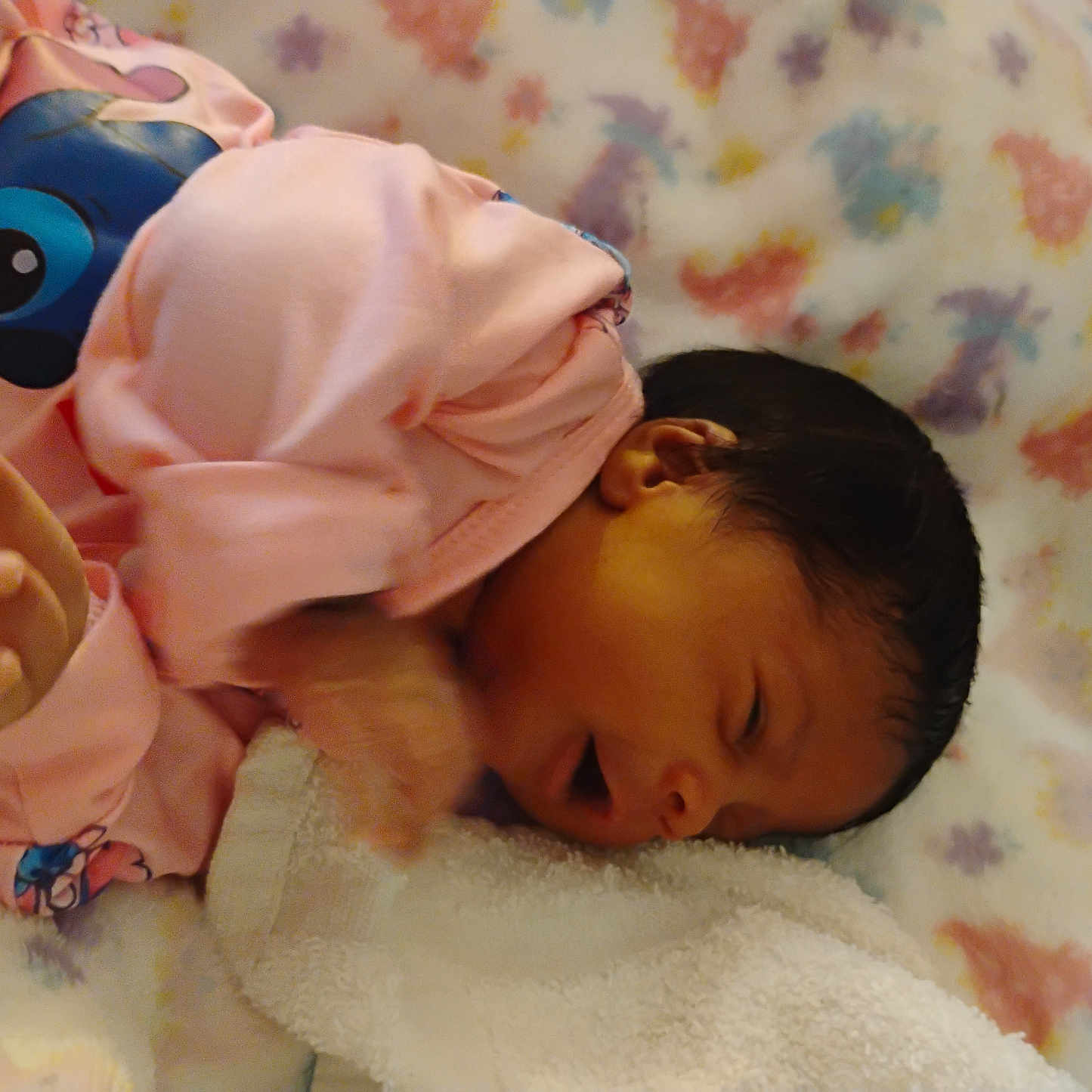 Ernlyiana joined the competition — help win amazing prizes! baby, blanket, child, cozy, cute, dark_hair, face, floral_pattern, hand, head, indoors, infant, newborn, person, pink_clothing, resting, skin, sleeping, soft, young