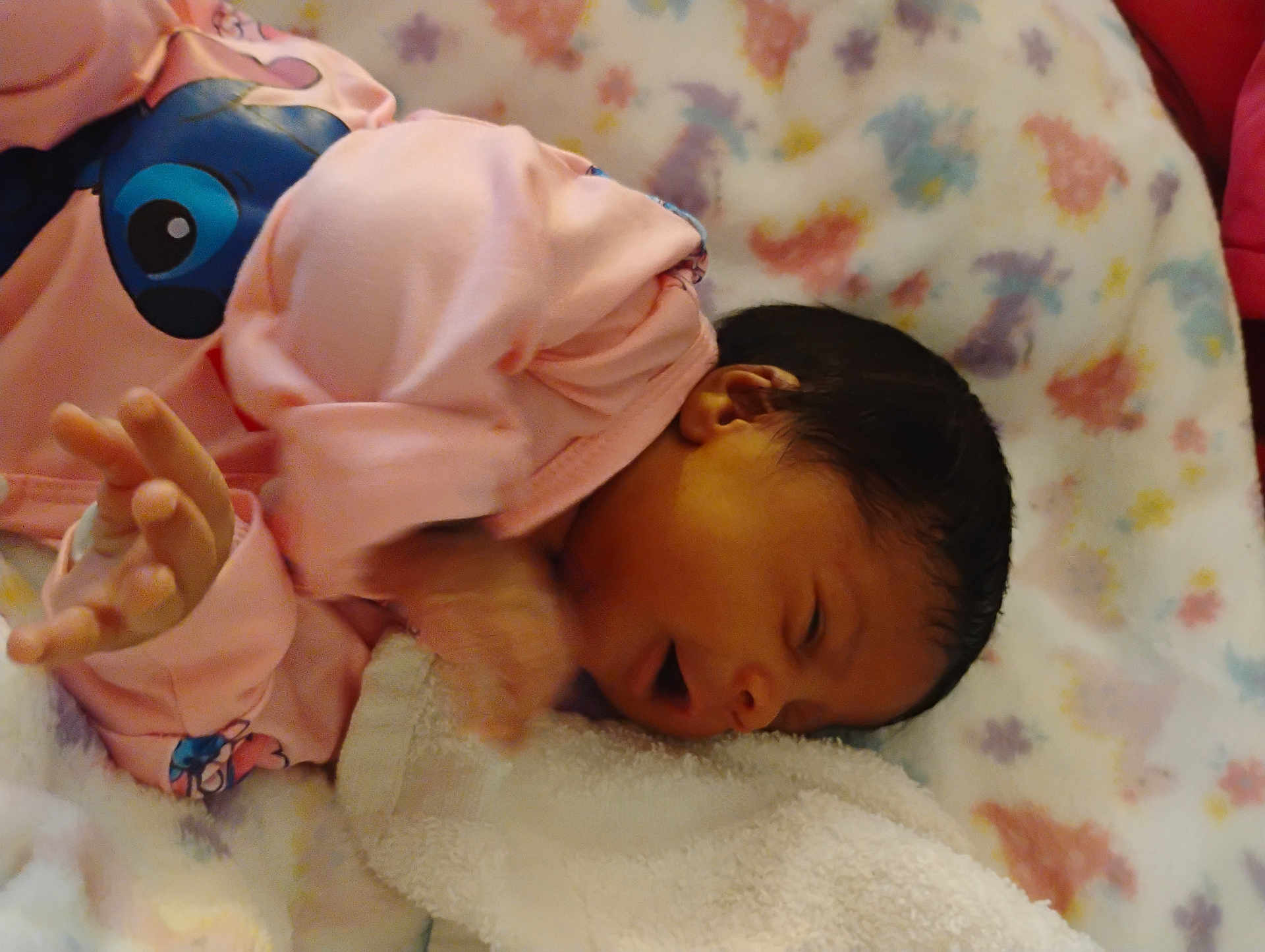 Ernlyiana joined the competition — help win amazing prizes! baby, newborn, infant, pink_clothing, blanket, floral_pattern, sleeping, hand, face, person, cute, resting, soft, indoors, child, young, skin, head, dark_hair, cozy