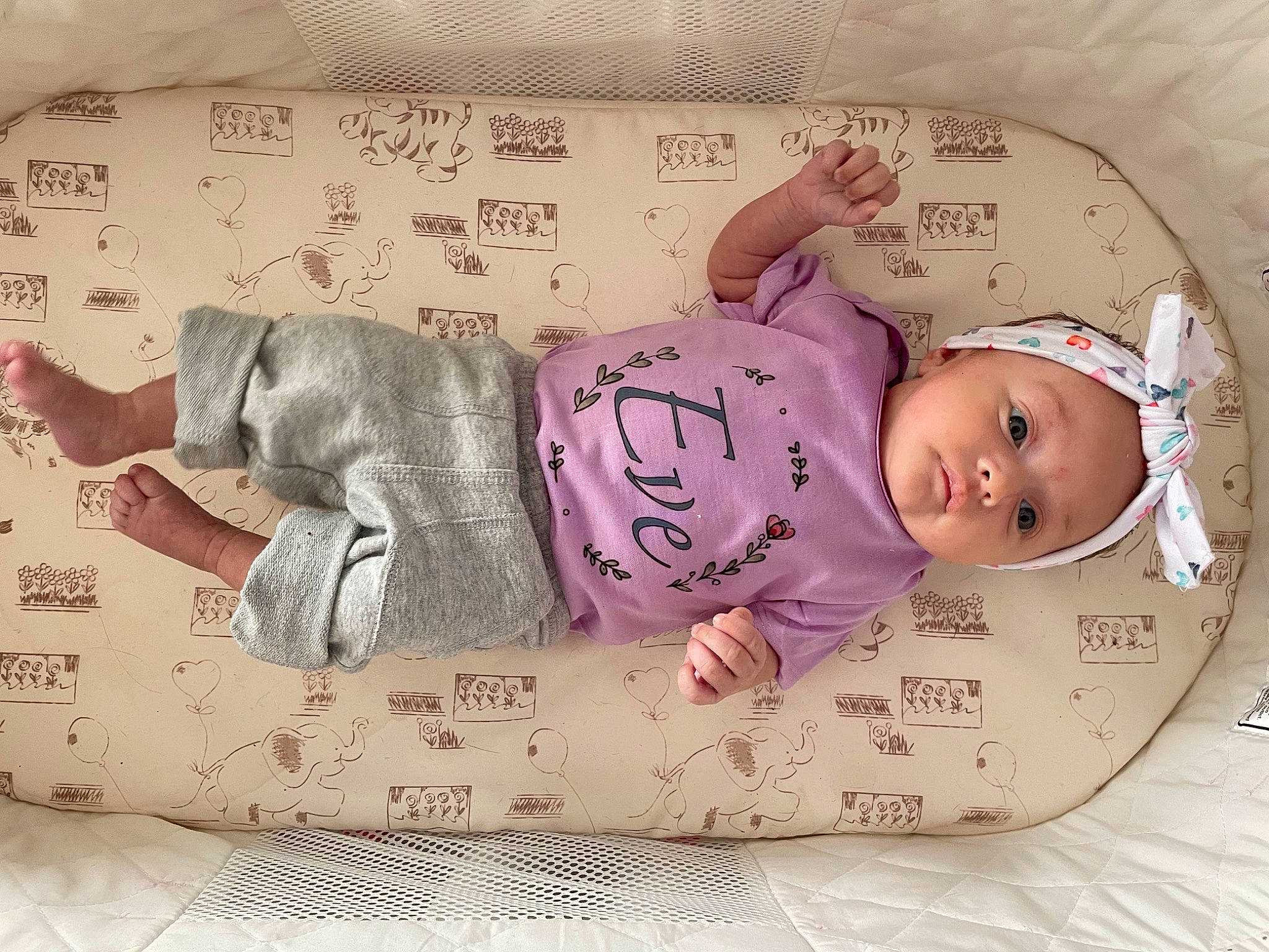 Eve is registered to the contest to win money with this photo: baby, baby_products, baby_safety, baby_sleeping, baby_toddler_clothing, cheek, child, comfort, hand, headwear, linens, magenta, mammal, pattern, person, pink, product, room, skin, sleeve
