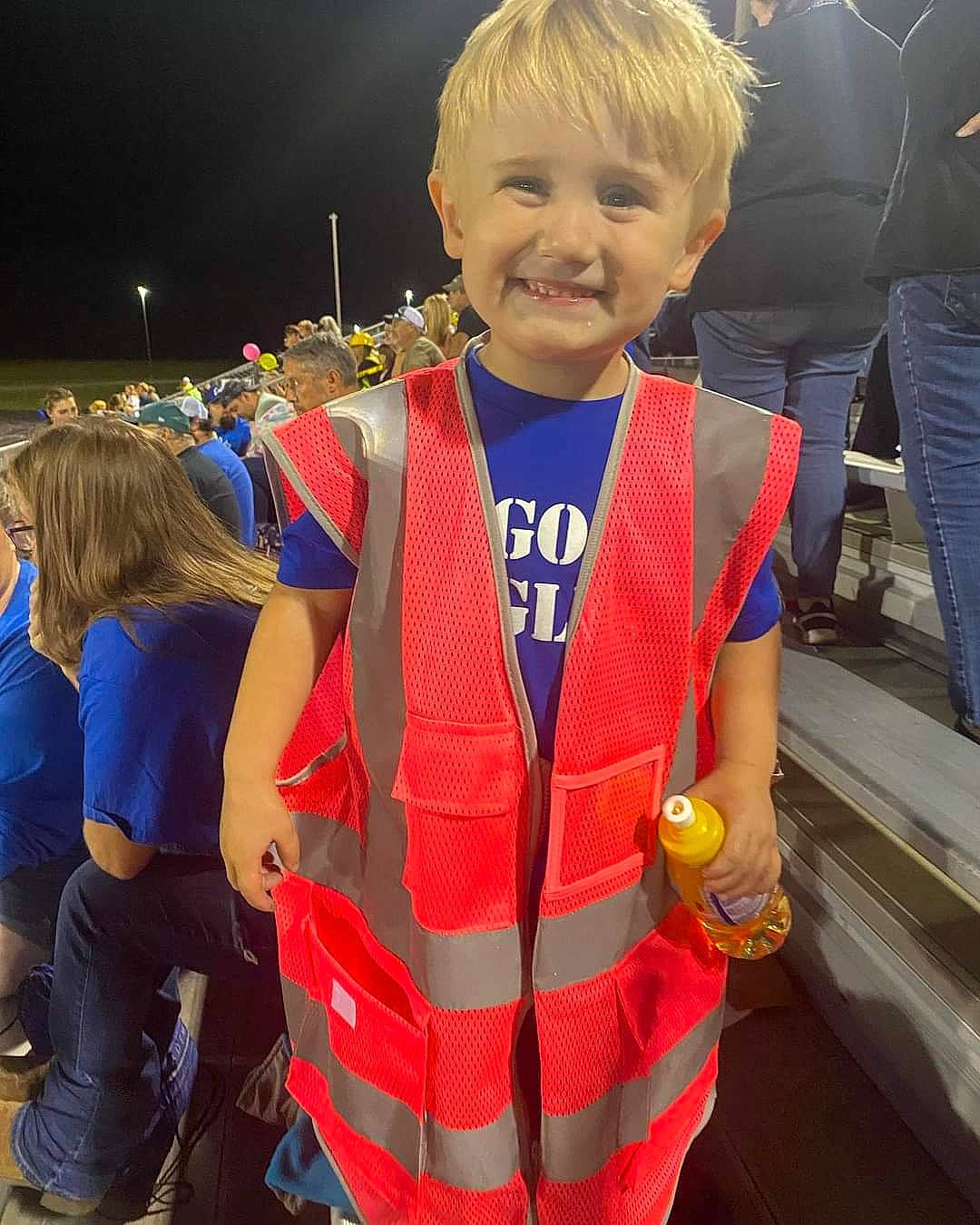 Waylon is registered to the contest to win money with this photo: bag, child, costume, electric_blue, event, fashion_accessory, fun, gesture, happy, jewellery, joy, lifejacket, orange, person, personal_protective_equipment, recreation, smile, t_shirt, toddler, tradition