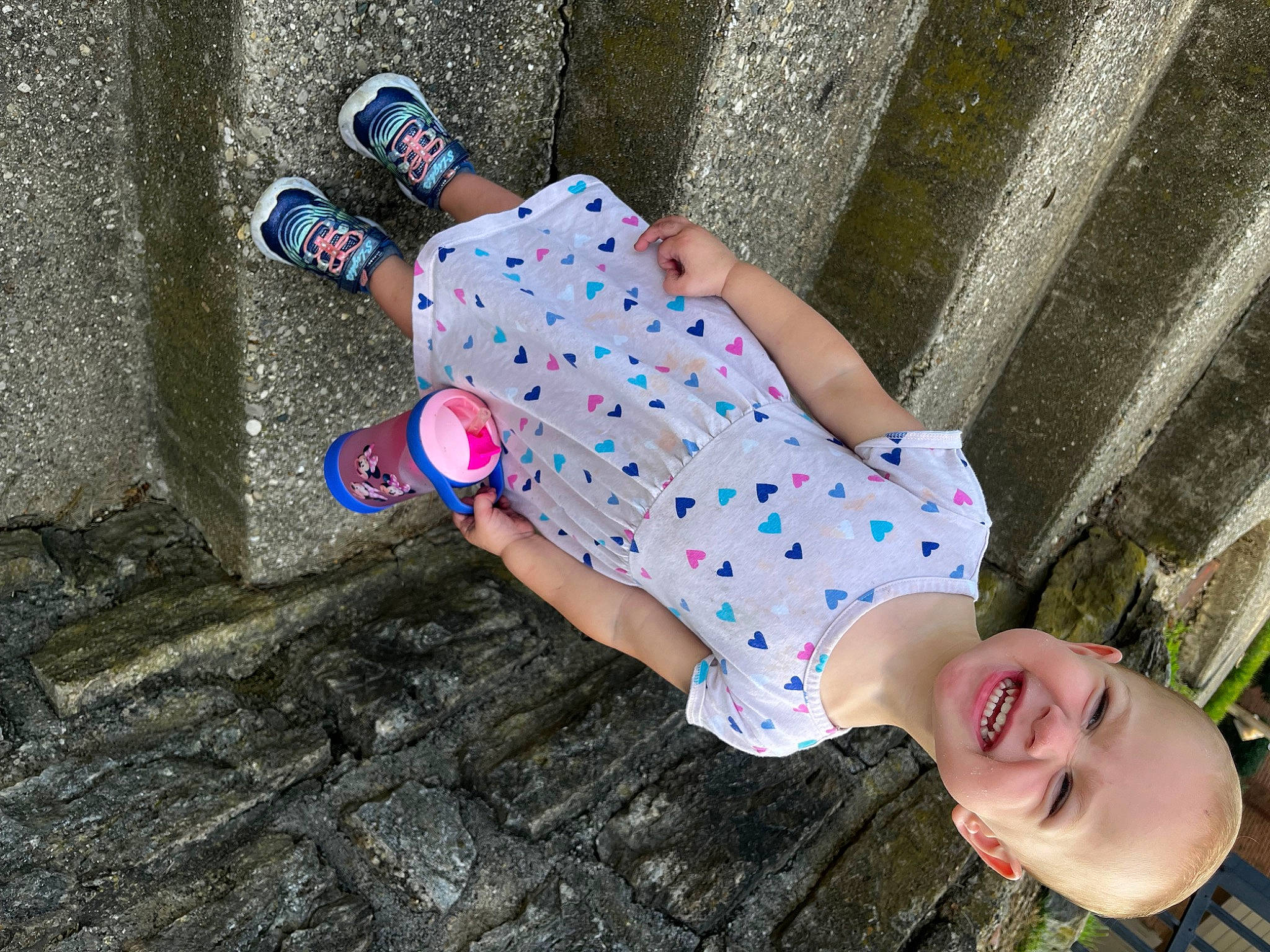 Raylynn joined the competition — help win amazing prizes! child, concrete, electric_blue, eyewear, foot, fun, grass, happy, human_leg, joy, leisure, pattern, people_in_nature, person, sandal, smile, sunglasses, thigh, toddler, toy
