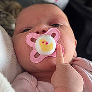 Freya joined the competition — help win amazing prizes! baby, infant, pacifier, pink, duck, close_up, face, hand, finger, clothing, blanket, soft, cute, skin, newborn, portrait, indoor, child, young, comfort