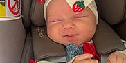 Freya is registered to the contest to win money with this photo: baby, infant, sleeping, headband, strawberry, car_seat, blanket, pink, cute, child, clothing, hand, face, cozy, comfort, newborn, apparel, soft, rest, adorable
