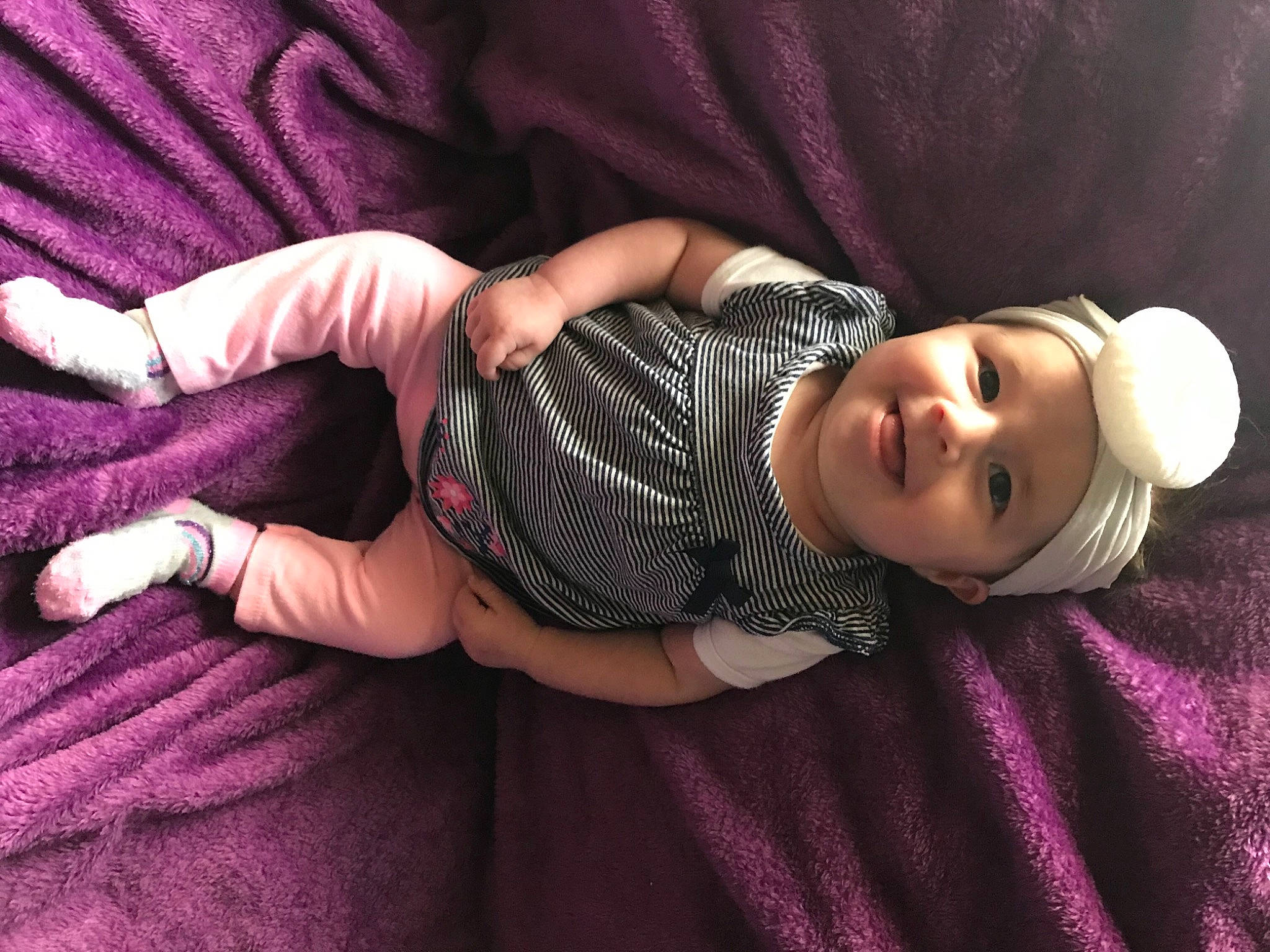 Jayanna is registered to the contest to win money with this photo: arm, baby, child, finger, hand, headwear, joy, nap, person, purple, toddler