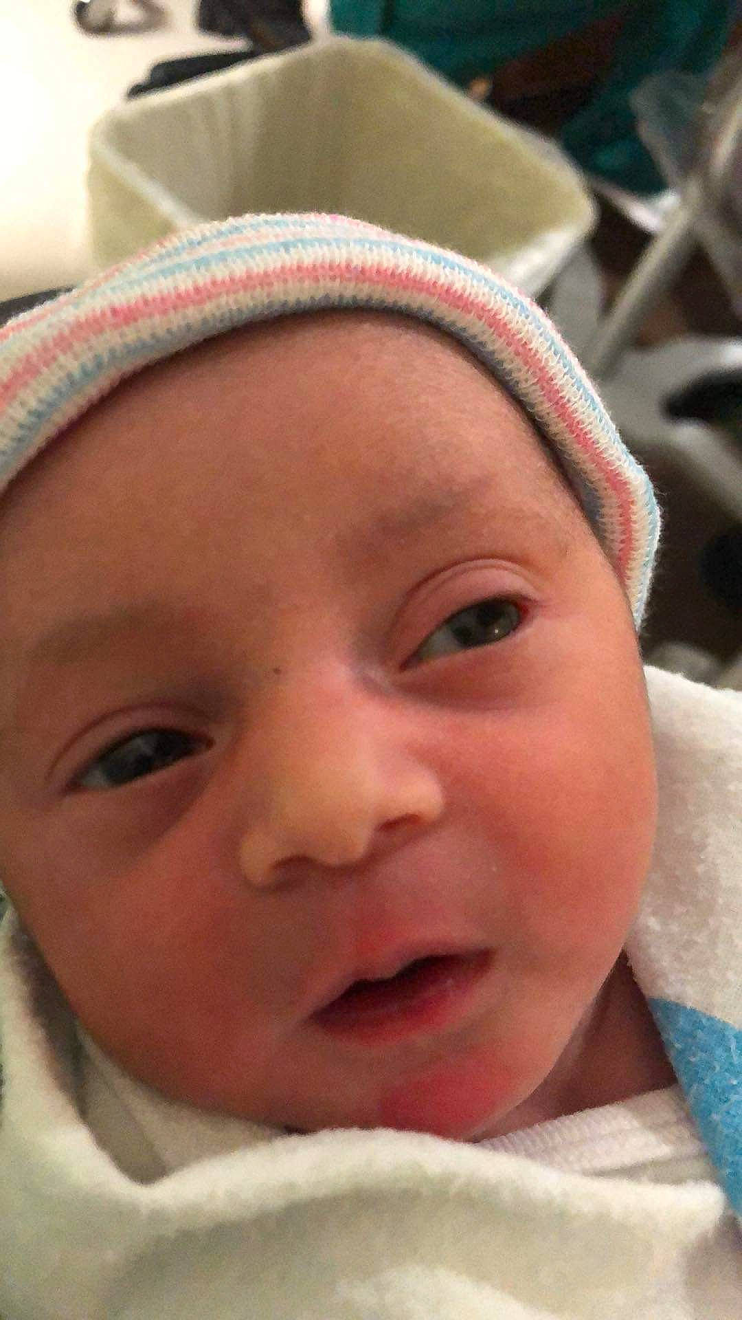 Christie is registered to the contest to win money with this photo: baby, cheek, chin, comfort, eye, eyebrow, eyelash, facial_expression, forehead, fun, happy, headgear, headwear, iris, lip, mouth, nose, person, pink, skin