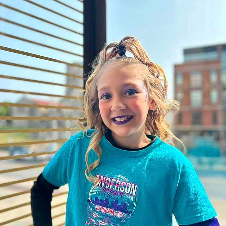 Arabella is registered to the contest to win money with this photo: blonde, brownhair, child, clothing, face, female, girl, hair, happy, head, longsleeve, person, photography, portrait, racket, sleeve, smile, sport, t_shirt, tennis