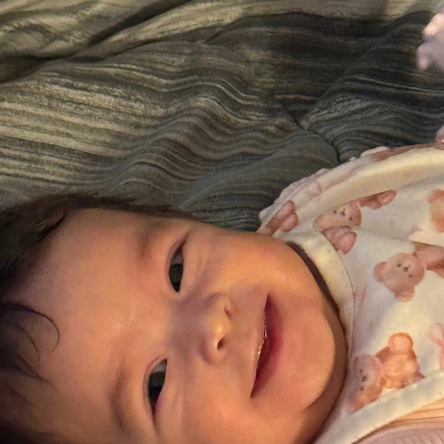 Maryory joined the competition — help win amazing prizes! baby, baby_clothes, bib, blanket, child, closeup, cute, face, happy, indoors, infant, lying_down, person, portrait, skin, smiling, soft_lighting, teddy_bear_pattern, warm_colors, young