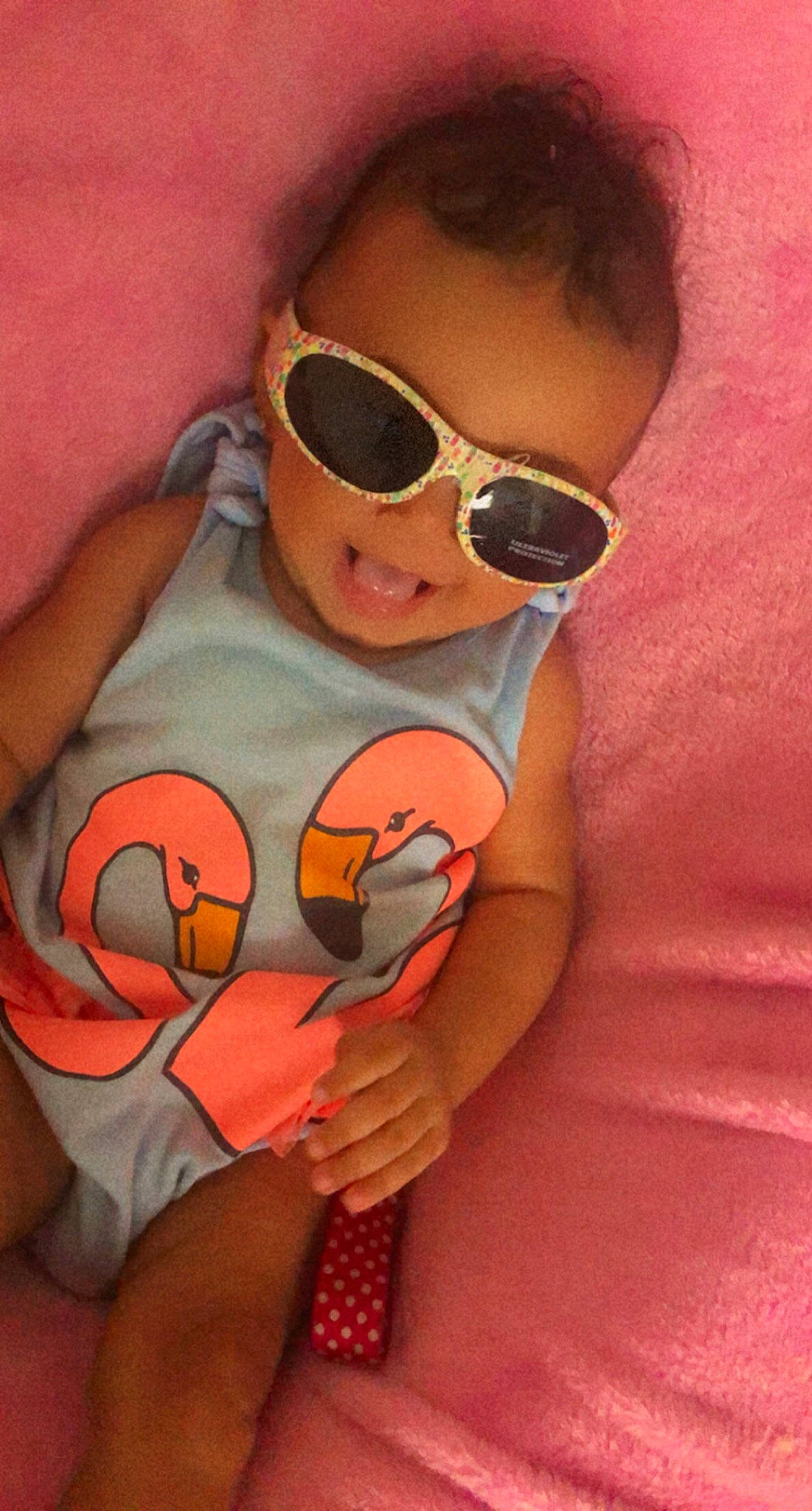 Kayonna is registered to the contest to win money with this photo: baby_toddler_clothing, chest, cool, eyewear, finger, glasses, goggles, hand, human_body, lip, mouth, muscle, neck, orange, person, pink, shoulder, skin, stomach, sunglasses