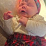 baby, infant, sleeping, headband, plaid, red, skirt, clothing, blanket, soft, cute, child, portrait, indoor, hands, face, peaceful, cozy, newborn, resting