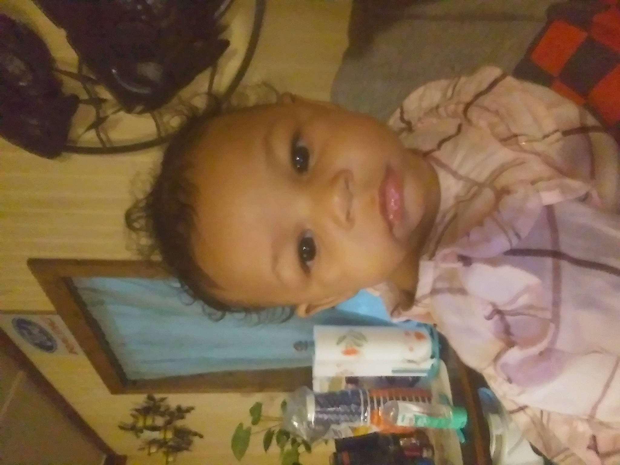 Annalise is registered to the contest to win money with this photo: baby, baby_toddler_clothing, cheek, child, eyelash, flooring, fun, hardwood, iris, mouth, nose, organ, person, plaid, room, skin, tartan, toddler, tree, wood