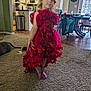 cabinet, carpet, child, clothing, curly_hair, dining_table, dog, floor, furniture, home, indoor, kitchen, light, person, playful, pose, red_dress, room, sparkly_shoes, window