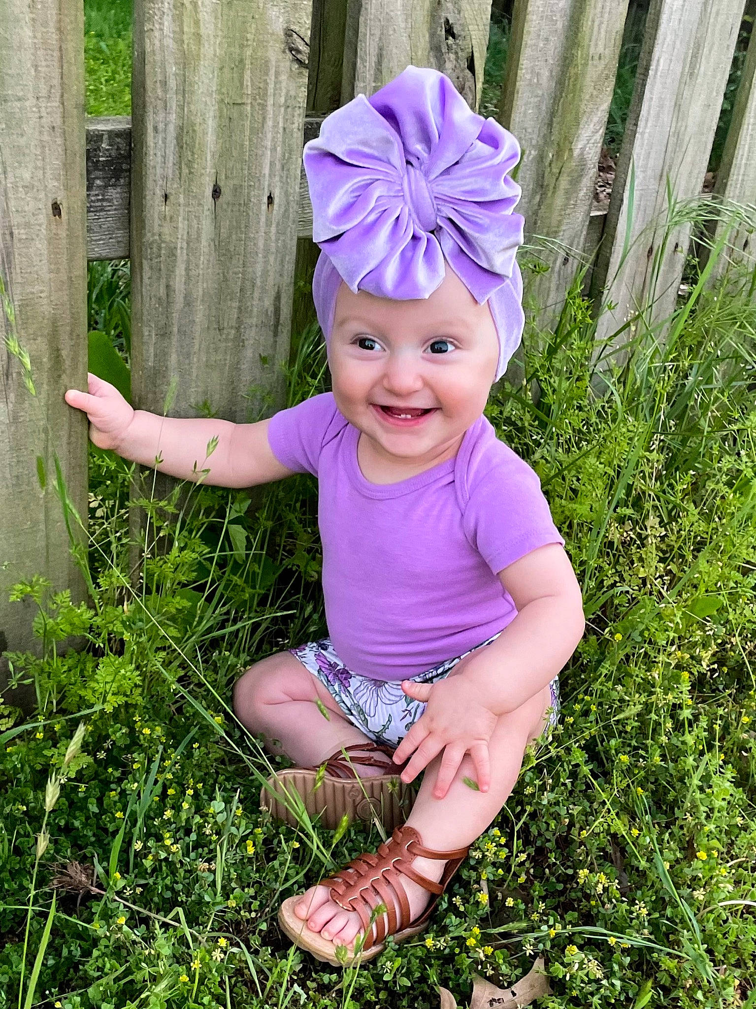 Marley joined the competition — help win amazing prizes! baby, baby_toddler_clothing, cap, costume_hat, electric_blue, face, fashion_accessory, fence, grass, happy, headband, headpiece, headwear, joy, magenta, people_in_nature, person, pink, plant, purple