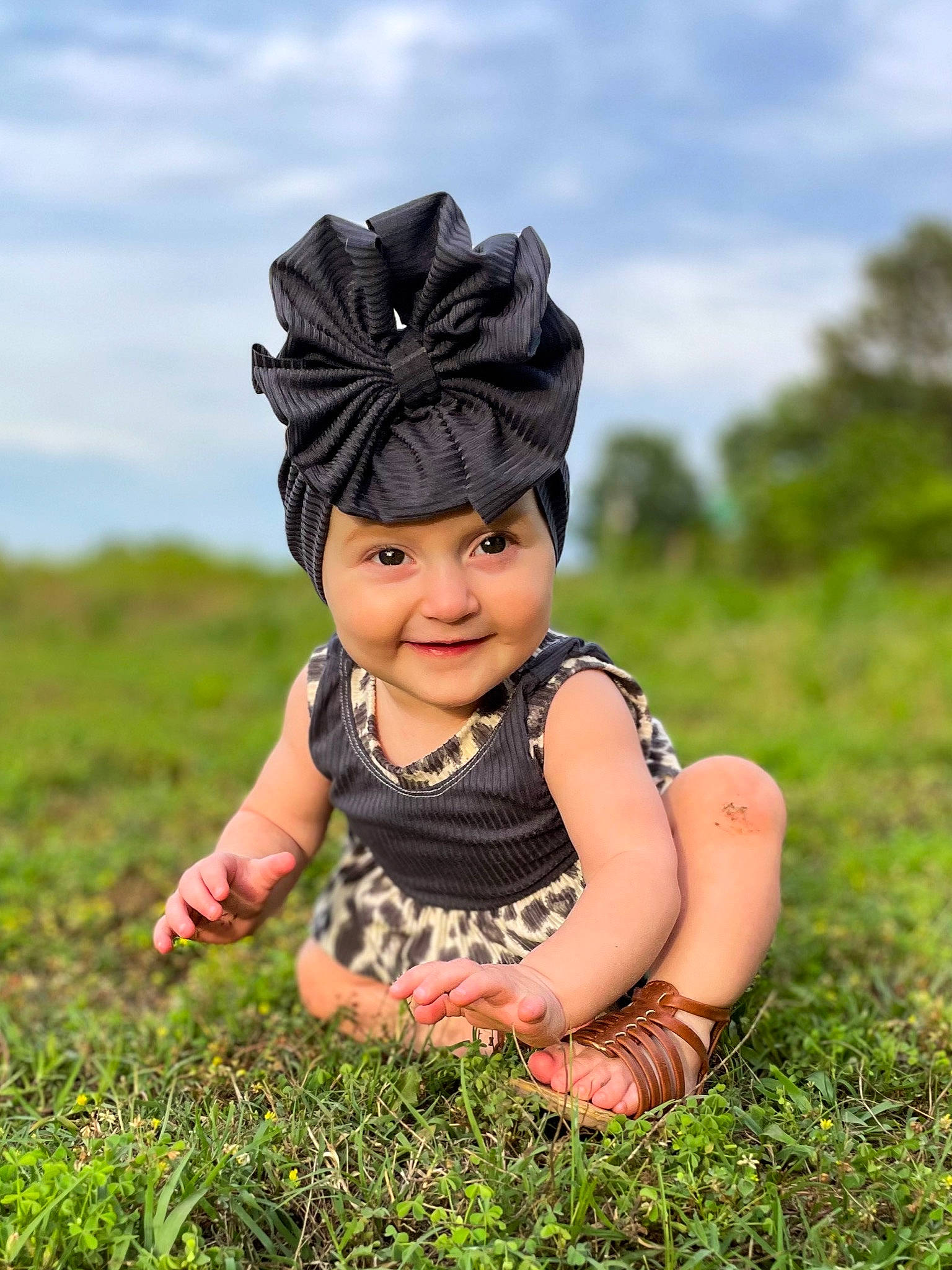 Marley is registered to the contest to win money with this photo: baby, baby_toddler_clothing, cap, child, cloud, flash_photography, fun, grass, grassland, happy, headgear, headwear, joy, landscape, meadow, people_in_nature, person, personal_protective_equipment, plant, sky