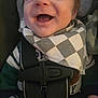 James is registered to the contest to win money with this photo: baby, bib, car_seat, checkered_pattern, child, close_up, clothing, cute, expression, face, happiness, indoors, infant, joyful, person, portrait, seatbelt, smiling, straps, young_child