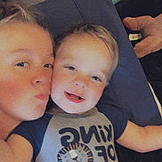 Haxton is registered to the contest to win money with this photo: baby, bed, bedroom, clothing, couch, cushion, face, furniture, happy, head, homedecor, indoors, person, photography, pillow, portrait, room, selfie, sleeping, t_shirt