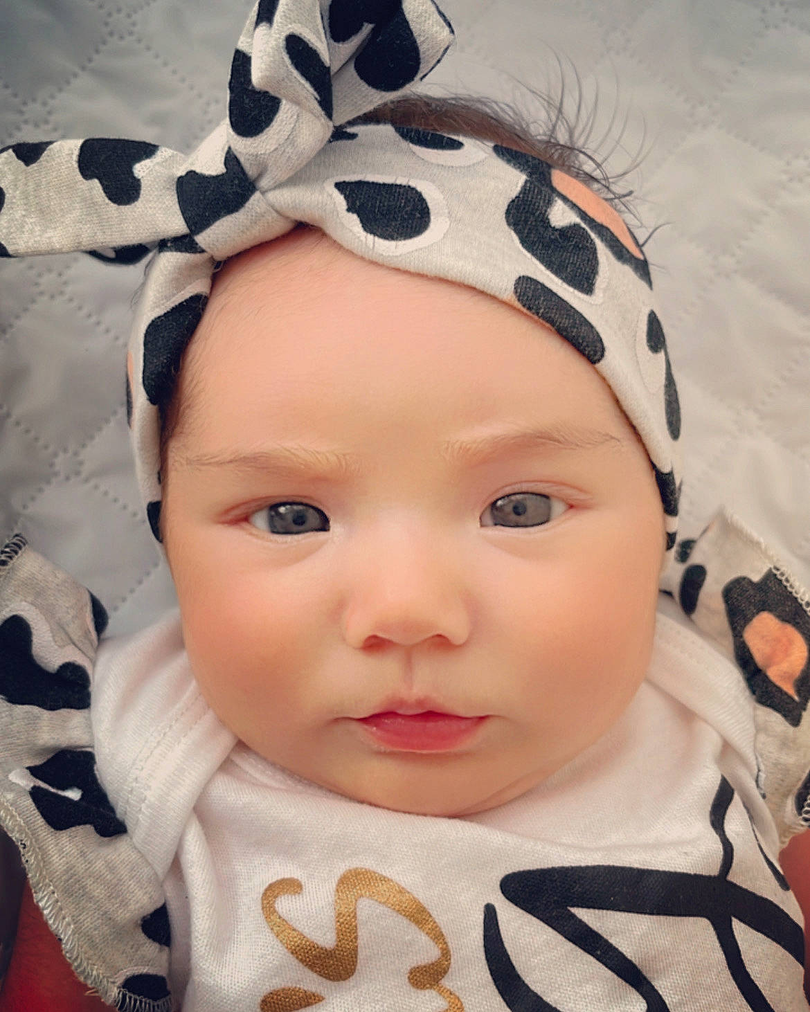 Leia joined the competition — help win amazing prizes! baby_toddler_clothing, cap, cheek, chin, ear, eye, eyebrow, eyelash, face, happy, head, headgear, headwear, human_body, nose, organ, outerwear, person, skin, sleeve