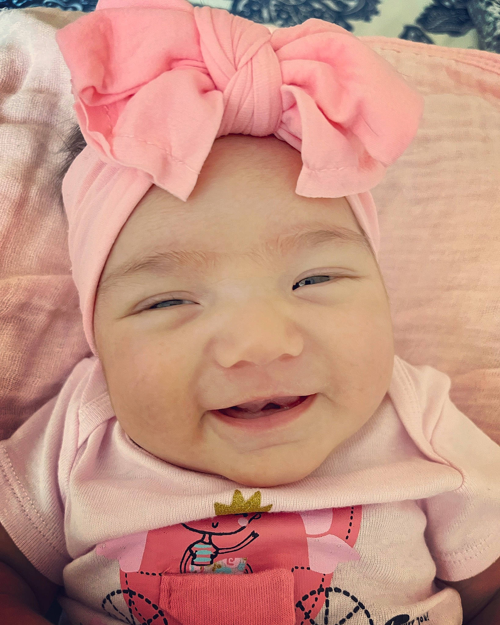 Leia joined the competition — help win amazing prizes! baby, baby_toddler_clothing, cheek, child, chin, cool, face, fashion_accessory, happy, headwear, lip, magenta, outerwear, pattern, person, pink, red, skin, sleeve, smile