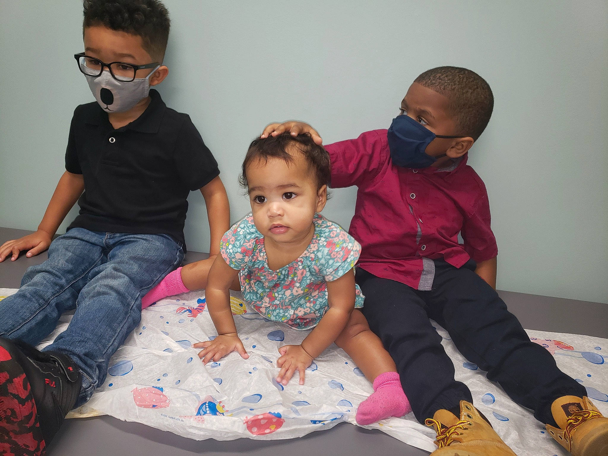 Ocean joined the competition — help win amazing prizes! baby_toddler_clothing, child, comfort, event, eyewear, face, facial_expression, flooring, fun, glasses, goggles, happy, head, interaction, leisure, person, room, sharing, sitting, t_shirt