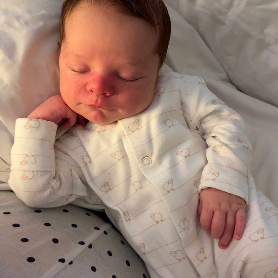 Elijah is registered to the contest to win money with this photo: baby, bed, bedroom, blanket, bodypart, cushion, face, finger, furniture, hand, head, homedecor, indoors, newborn, person, photography, portrait, quilt, room, sleeping