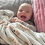 baby, blanket, smiling, happy, infant, cozy, cute, bed, pillow, child, wrapped, soft, indoor, person, portrait, comfort, warm, clothing, toddler, resting