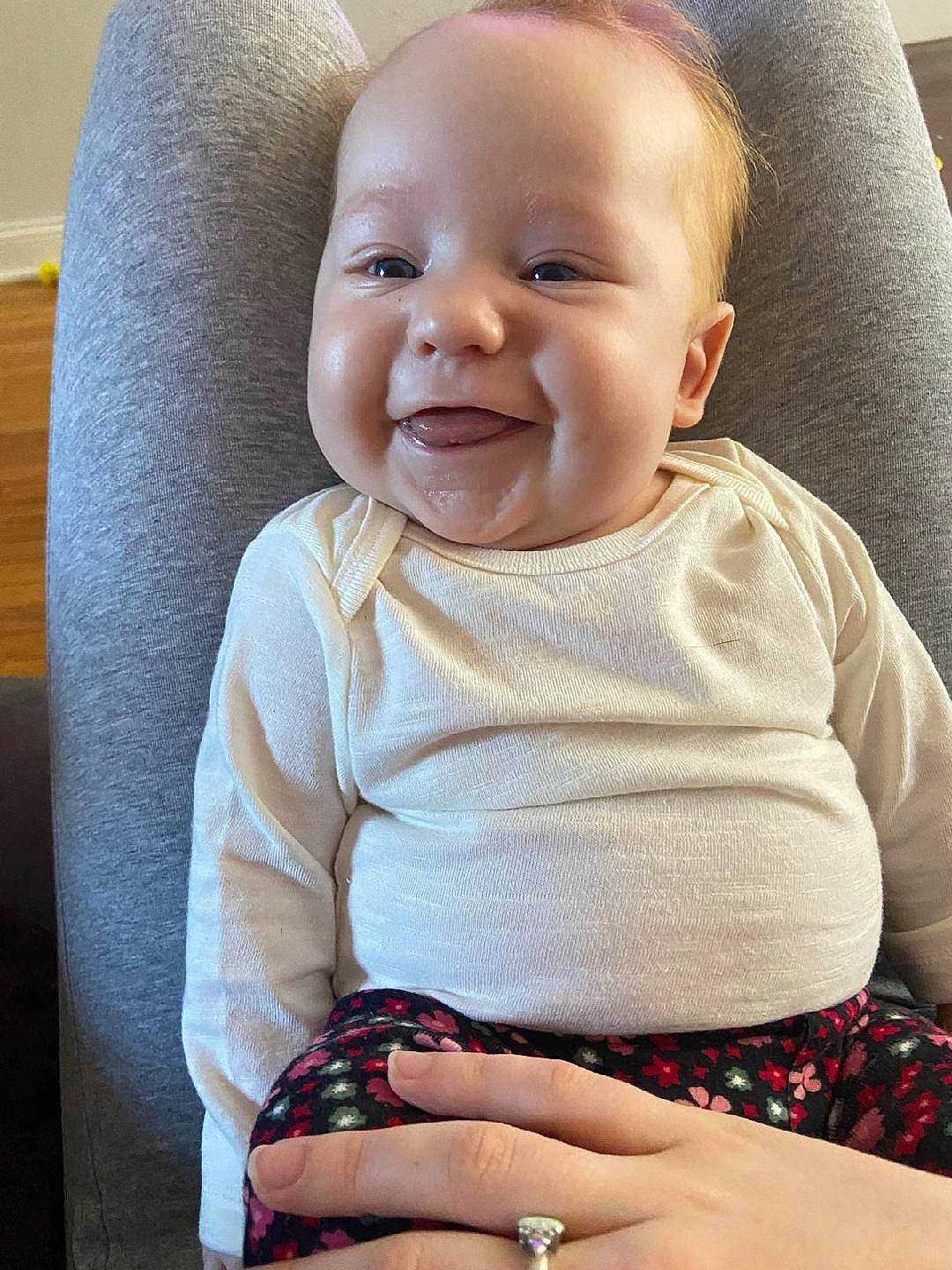 Ellie joined the competition — help win amazing prizes! baby, baby_products, baby_toddler_clothing, cheek, child, chin, comfort, face, finger, happy, iris, nail, neck, pattern, person, sitting, skin, sleeve, smile, standing